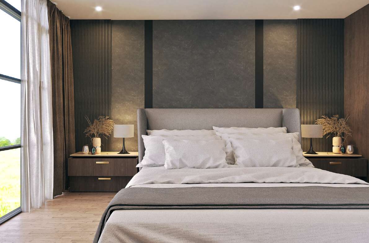 Bedroom with a charcoal panelled headboard wall and bedside lamps