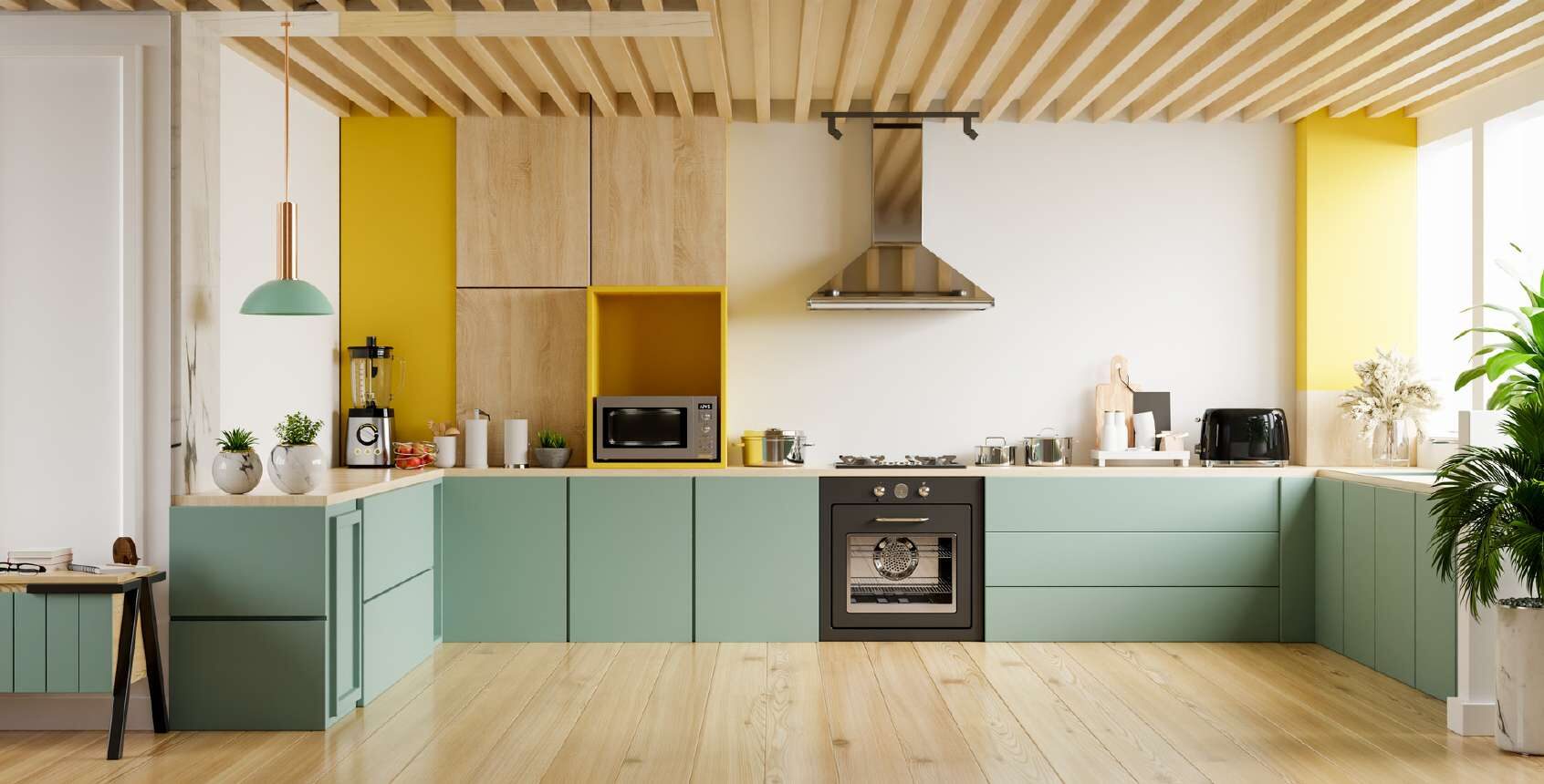 Sage green L-shaped kitchen with a timber slat ceiling and a yellow niche