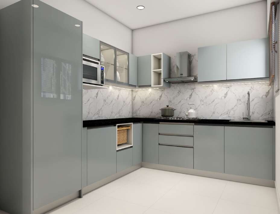 Grey L-shaped modular kitchen with a marble backsplash and a tall fridge unit